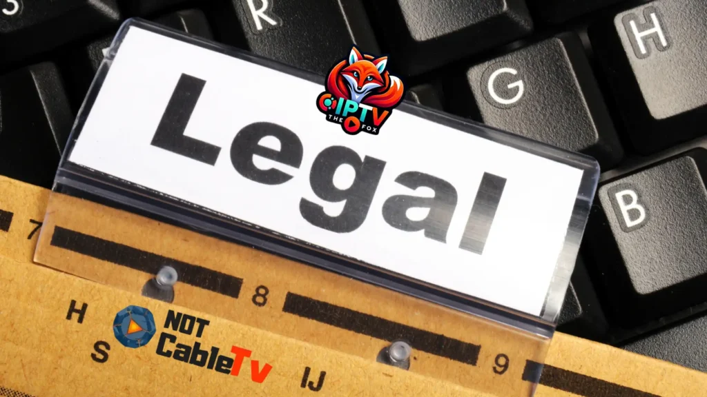 Legal disclaimer card on keyboard with IPTV THE FOX and NotCableTV logos, representing IPTV legality and streaming service transparency.